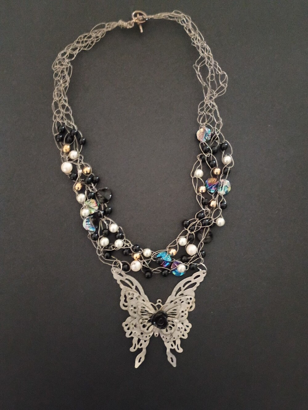 Handcrafted Silver Butterfly Pendant Necklace with Black and Iridescent Beads